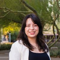 Valeria Gutierrez smiles at the camera.