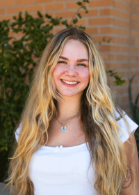 Natalie Olson smiles at the camera.